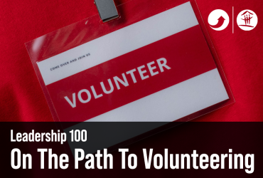 Volunteer badge on a red background