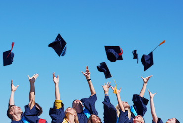 Young graduates celebrating