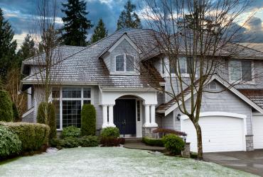 Home and front yard with early season snow storm